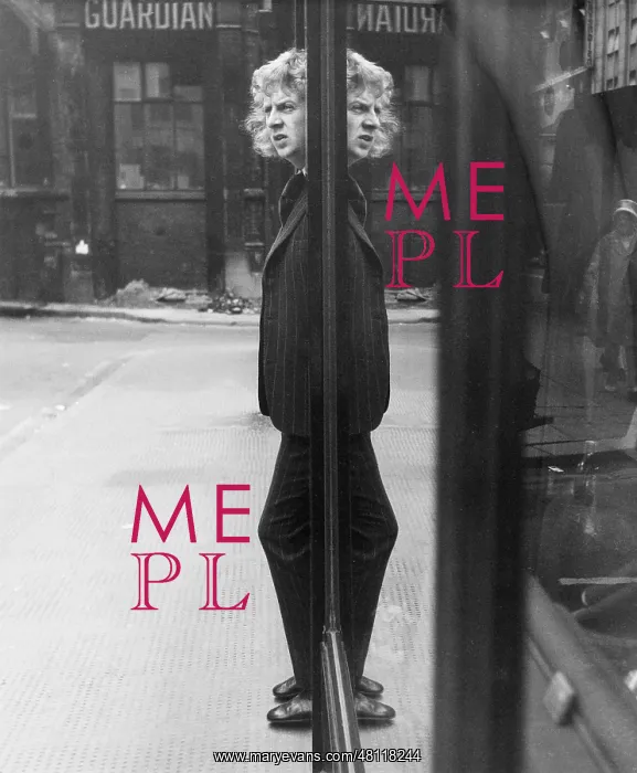 : Young man reflected in glass window : Young man reflected in glass window