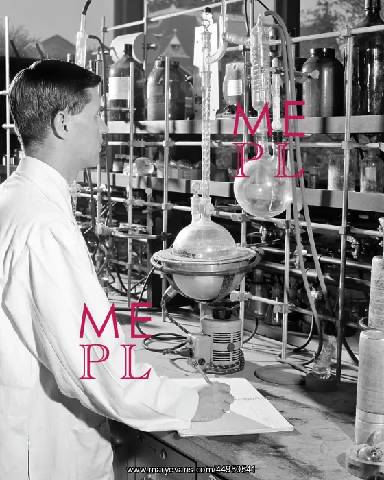 : Young Man Researcher Conducting Experiment in : Young Man Researcher Conducting Experiment in