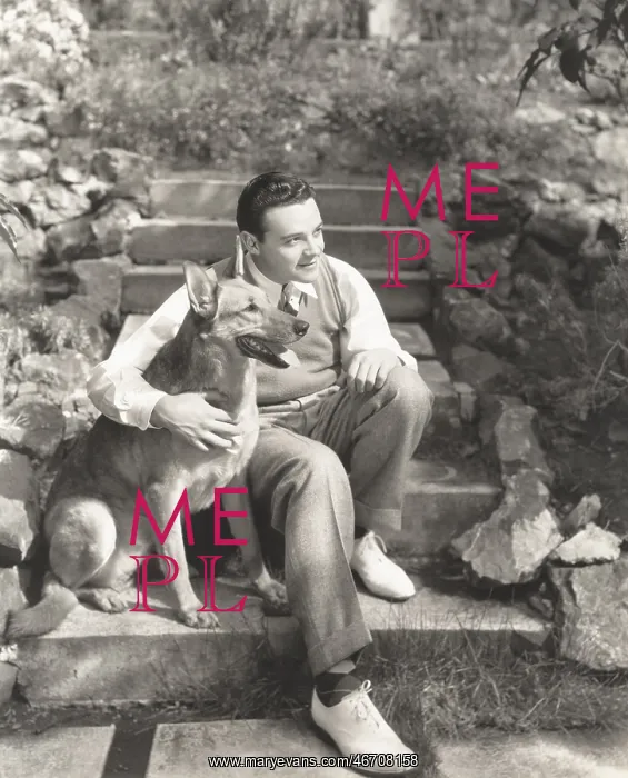  : Young man sitting with dog on steps outdoors