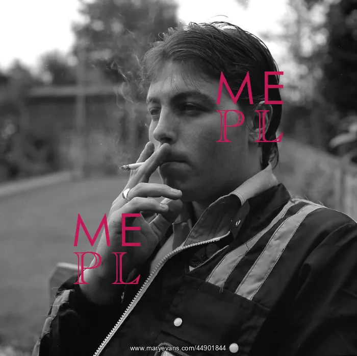 : Young man smoking a cigarette : Young man smoking a cigarette