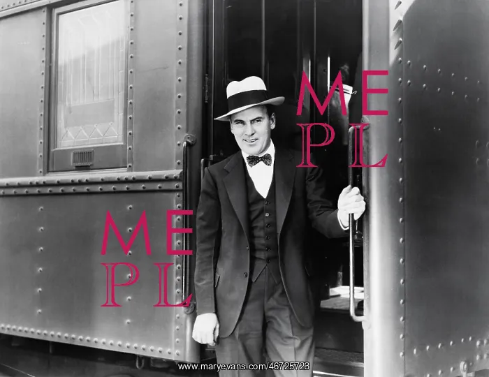 : Young man standing at the entrance of a train : Young man standing at the entrance of a train