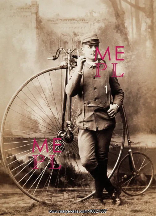 : Young man in uniform with a pennyfarthing bicycle : Young man in uniform with a pennyfarthing bicycle