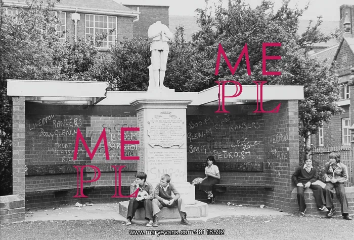 : Young people sitting by war memorial, Winsford, Cheshire : Young people sitting by war memorial, Winsford, Cheshire