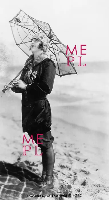 : Young woman on the beach with an umbrella looking : Young woman on the beach with an umbrella looking