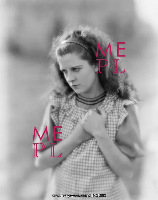 : Young woman clenching her hands looking sad : Young woman clenching her hands looking sad
