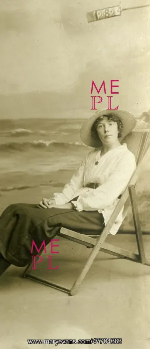 : Young woman in a deckchair in a studio photo : Young woman in a deckchair in a studio photo