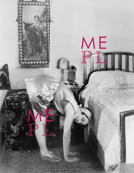  : Young woman doing her morning exercise next to her bed