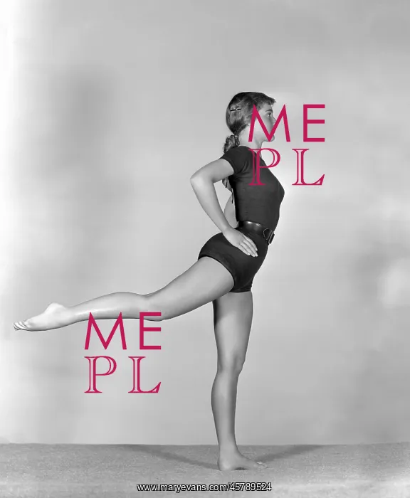 : Young woman executing back leg lift : Young woman executing back leg lift