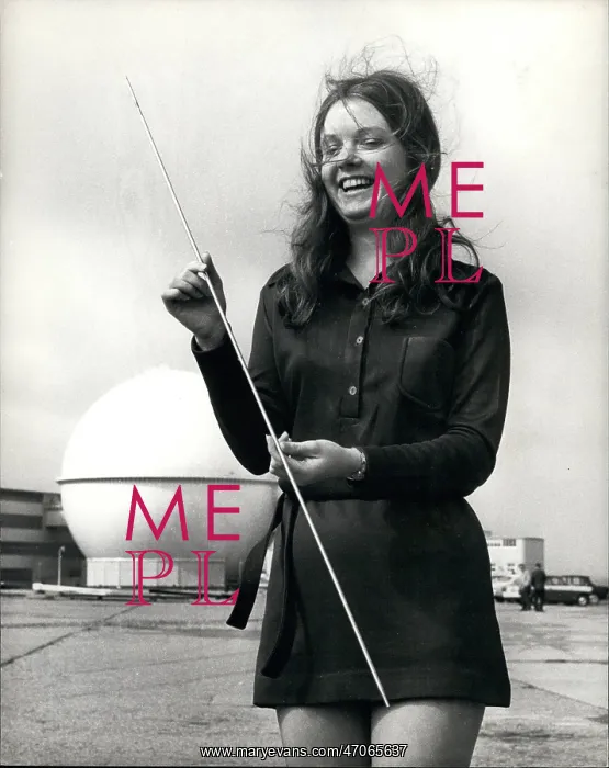 : Young woman with fuel pin from prototype nuclear reactor : Young woman with fuel pin from prototype nuclear reactor