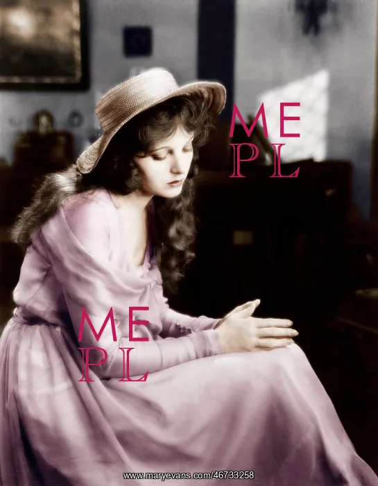 : Young woman in a hat sitting and looking sad : Young woman in a hat sitting and looking sad