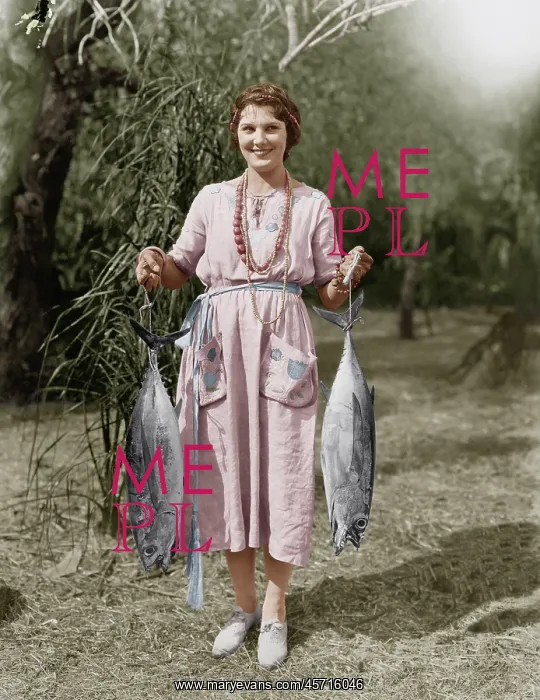 : Young woman holding two huge fish : Young woman holding two huge fish