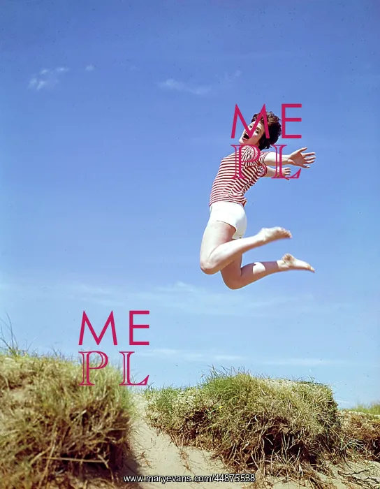 : Young woman leaps up from a sand dune : Young woman leaps up from a sand dune