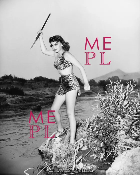 : Young woman in leopard skin with a spear : Young woman in leopard skin with a spear