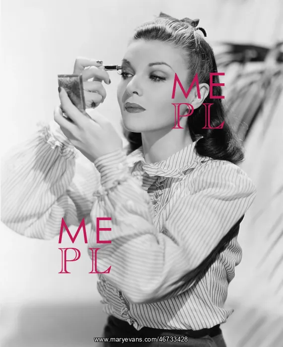 : Young woman looking into a mirror and putting on make up : Young woman looking into a mirror and putting on make up