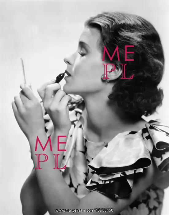 : Young woman looking into a mirror and putting on make up : Young woman looking into a mirror and putting on make up