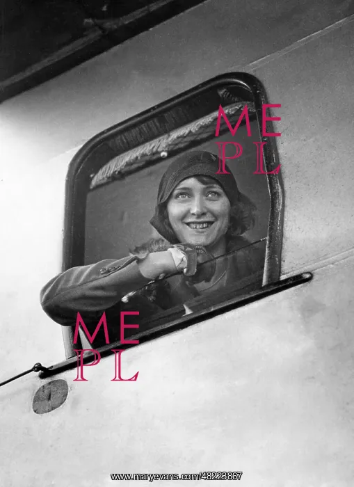 : Young woman looking past an open airplane window, 1929 : Young woman looking past an open airplane window, 1929