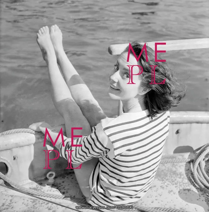 : Young woman modelling on a boat : Young woman modelling on a boat
