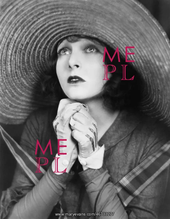 : Young woman praying in a big hat : Young woman praying in a big hat