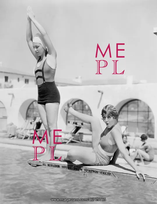 : Young woman preparing to dive from a diving platform : Young woman preparing to dive from a diving platform