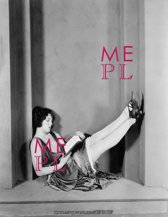 : Young woman sitting with her legs up and reading : Young woman sitting with her legs up and reading