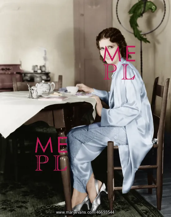 : Young woman sitting at a table having breakfast tea : Young woman sitting at a table having breakfast tea