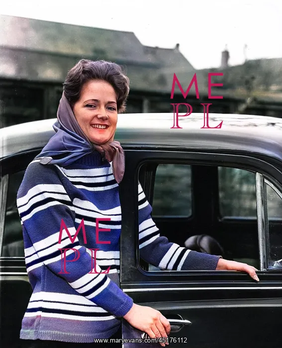  : Young woman standing by car