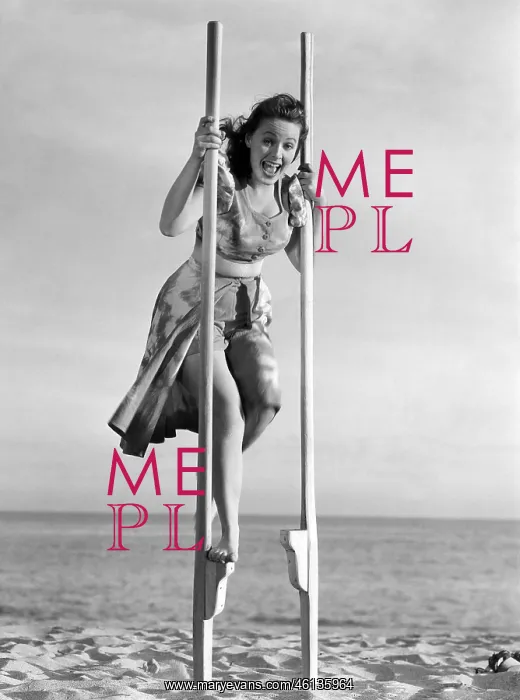  : Young woman on stilts at the beach