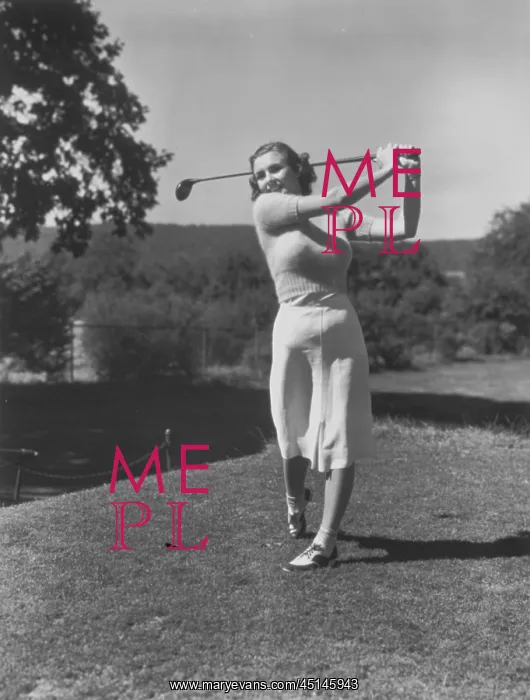 : Young Woman Teeing Off