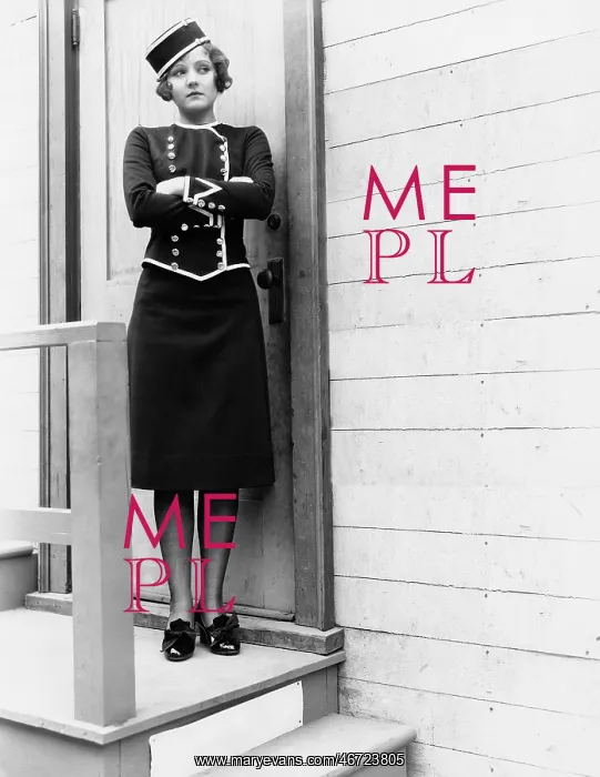  : Young woman in a uniform standing with her arms