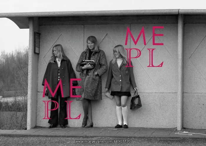 : Three young women in a bus shelter : Three young women in a bus shelter