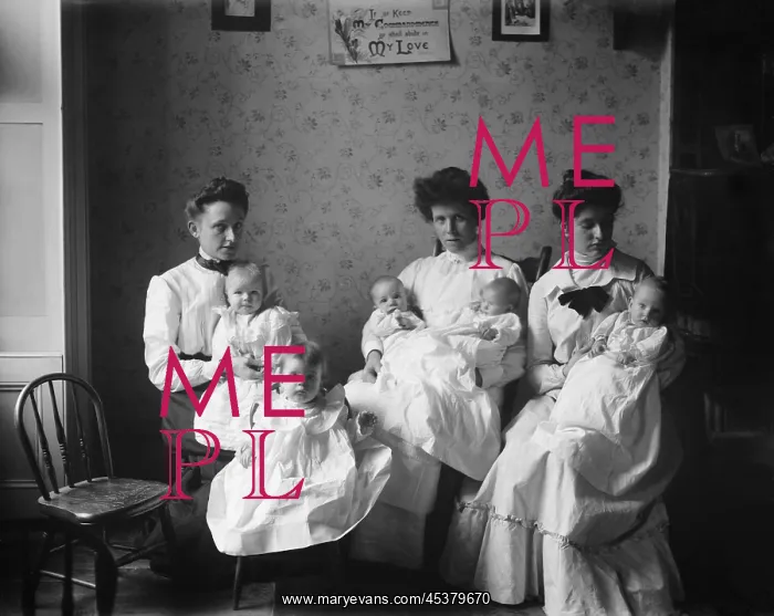 : Three young women hold five babies at the : Three young women hold five babies at the
