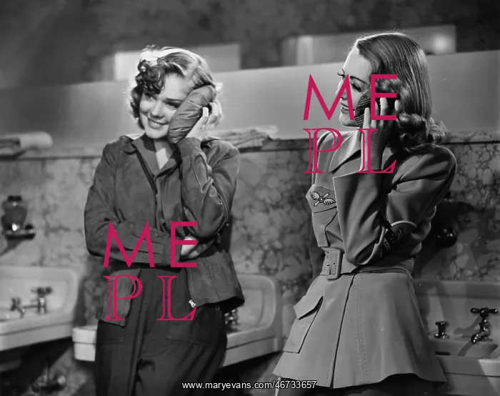 : Two young women leaning against a bathroom sink : Two young women leaning against a bathroom sink