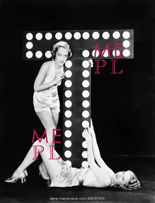  : Two young women posing with the letter T