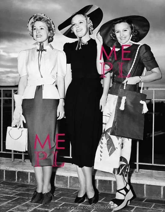 : Three young women standing side by side and smiling : Three young women standing side by side and smiling