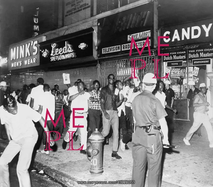 : Youthful crowd chanting along the sidewalk ? : Youthful crowd chanting along the sidewalk ?
