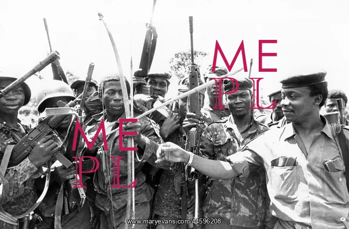 : Zaire officer checks one of his men using bow : Zaire officer checks one of his men using bow