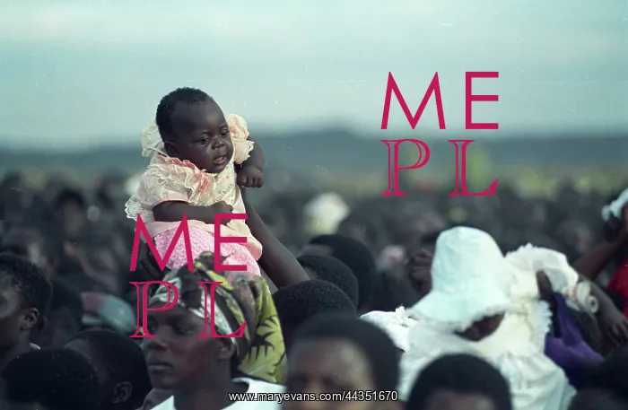 : Zimbabwe, 2000: A child is lifted above the crowd at : Zimbabwe, 2000: A child is lifted above the crowd at