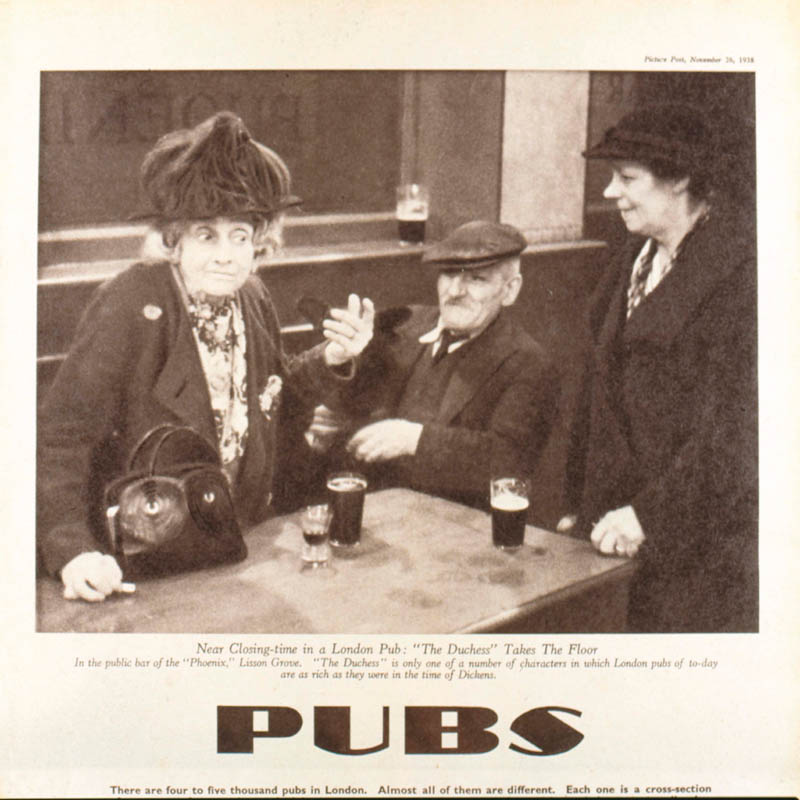 Just before closing time in The Phoenix pub, Lisson Grove, London. An elderly woman nicknamed The Duchess stands up and speaks. Date: 1938