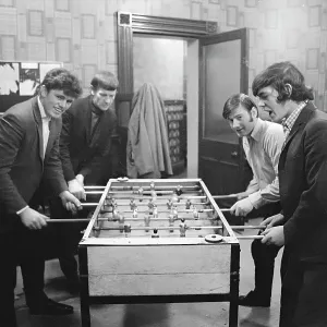 4 young men playing table football, Birch Villa pub 4 young men playing table football, Birch Villa pub