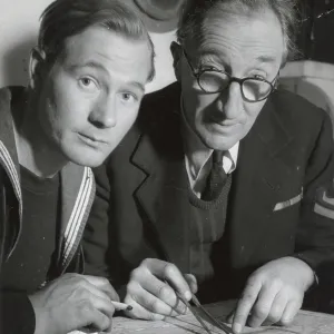 A. P. Herbert on a riverboat plotting a route with the crew