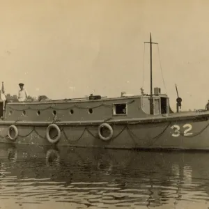 A. P. Herbert steering a riverboat