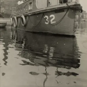 A. P. Herbert steering a riverboat