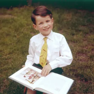 BOY READING BOOK BOY READING BOOK