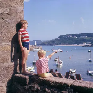 Two boys in the harbour, St Ives, Cornwall Two boys in the harbour, St Ives, Cornwall