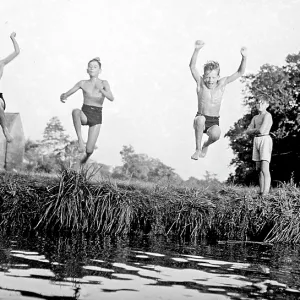 Boys jumping into a stream Boys jumping into a stream