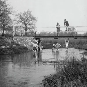 Boys in a stream and on a bridge Boys in a stream and on a bridge