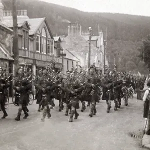Bridge Street, Ballater - Scots Highlanders led by Pipers marching Bridge Street, Ballater - Scots Highlanders led by Pipers marching