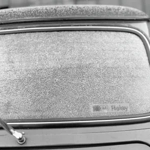 Car windshield covered in powdery snow Car windshield covered in powdery snow