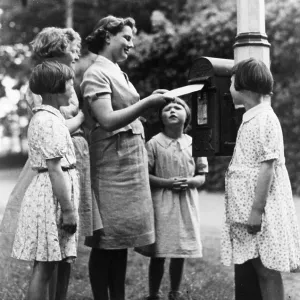 Children posting a letter Children posting a letter