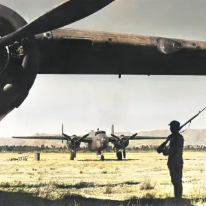 Chinese sentry guards American bomber